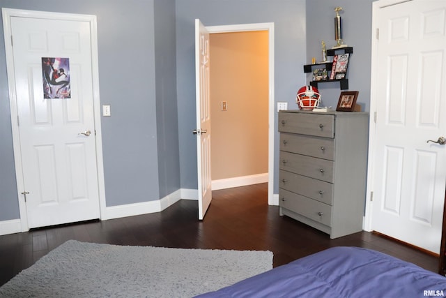 bedroom featuring dark hardwood / wood-style flooring