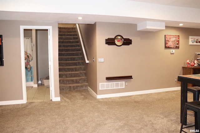 staircase with carpet floors