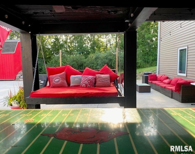 view of patio featuring an outdoor hangout area and a shed