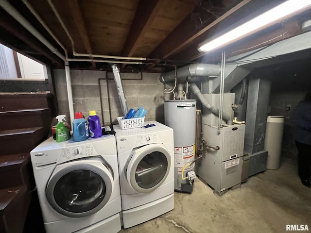 washroom featuring washer and dryer and water heater