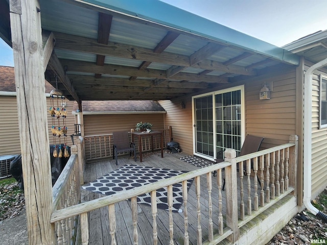 wooden deck featuring cooling unit