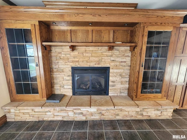 interior details with a stone fireplace