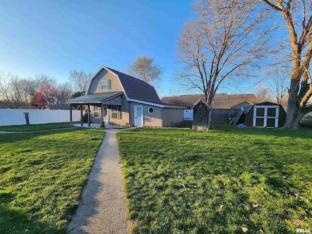 view of front of home with a shed and a front yard