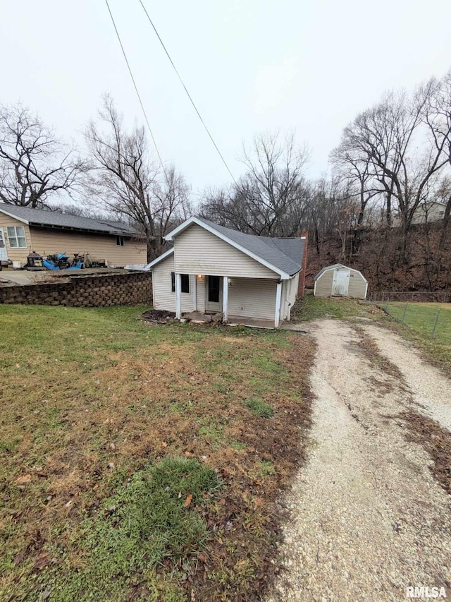 view of side of property with a yard