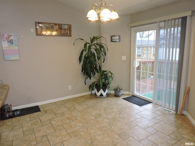 interior space featuring vaulted ceiling and an inviting chandelier