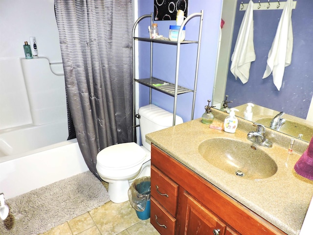 bathroom featuring tile patterned flooring, vanity, and toilet