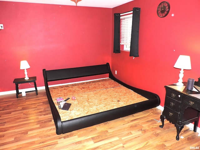 bedroom featuring wood-type flooring