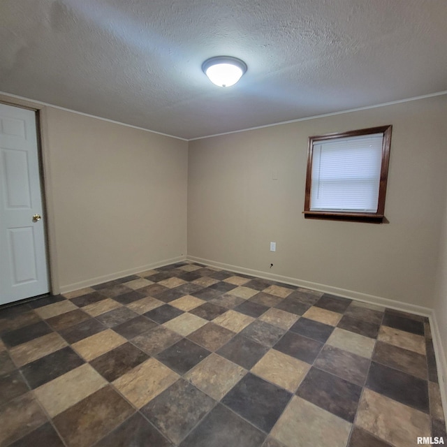 unfurnished room featuring a textured ceiling