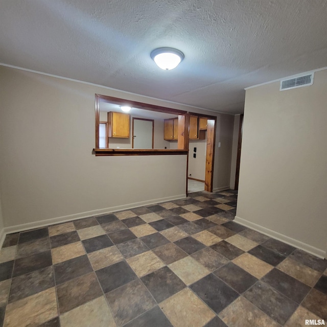 empty room with a textured ceiling