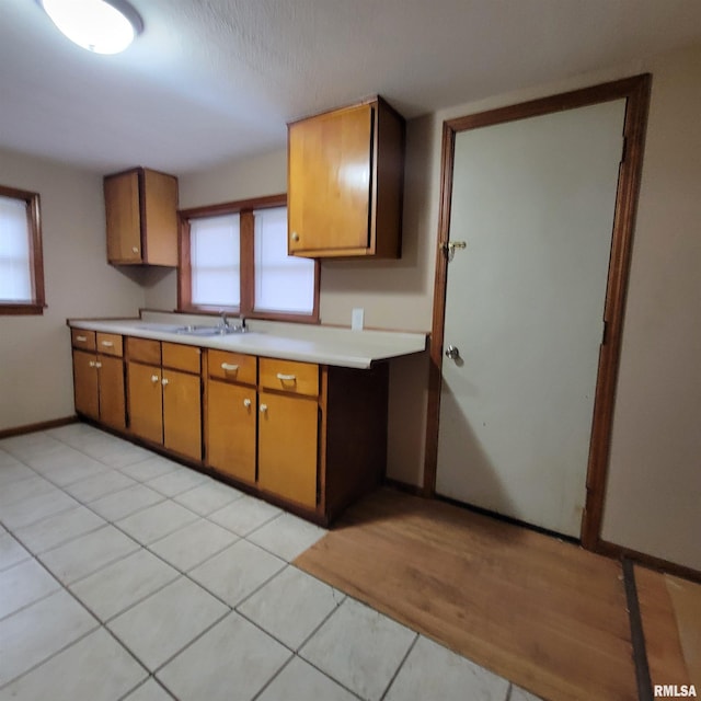 kitchen with sink and light tile patterned floors