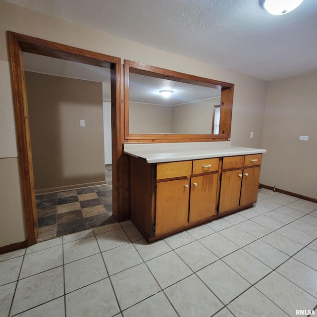 kitchen with a textured ceiling