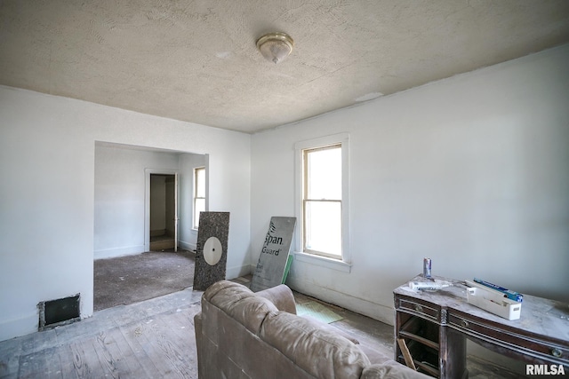 sitting room featuring a textured ceiling