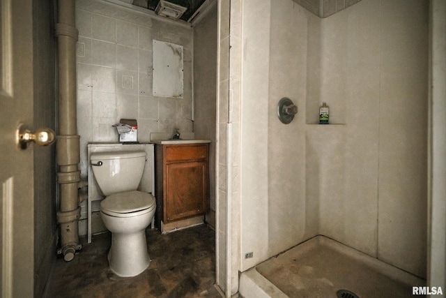 bathroom with a shower, vanity, and toilet