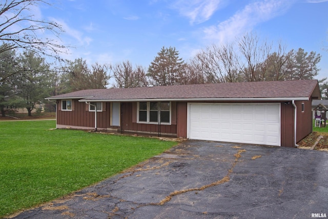 single story home with a front yard and a garage