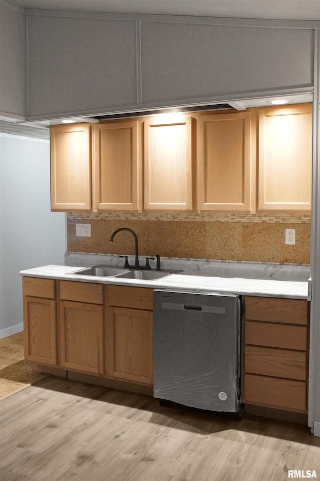 kitchen featuring stainless steel dishwasher, light hardwood / wood-style floors, sink, and light brown cabinets