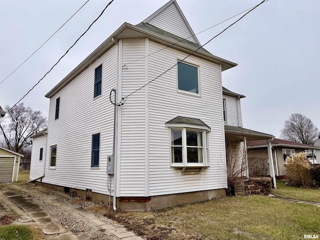 view of property exterior featuring a yard