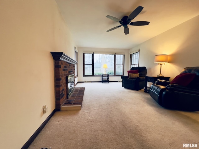 living room with carpet floors, a brick fireplace, and ceiling fan