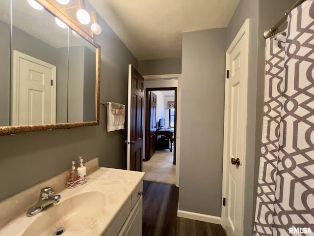 bathroom featuring vanity and wood-type flooring