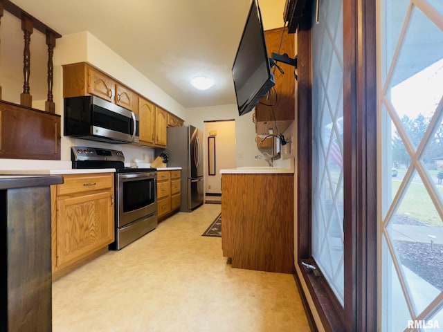 kitchen with appliances with stainless steel finishes and sink