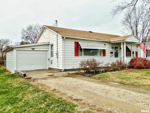 view of front of house with a garage and a front lawn