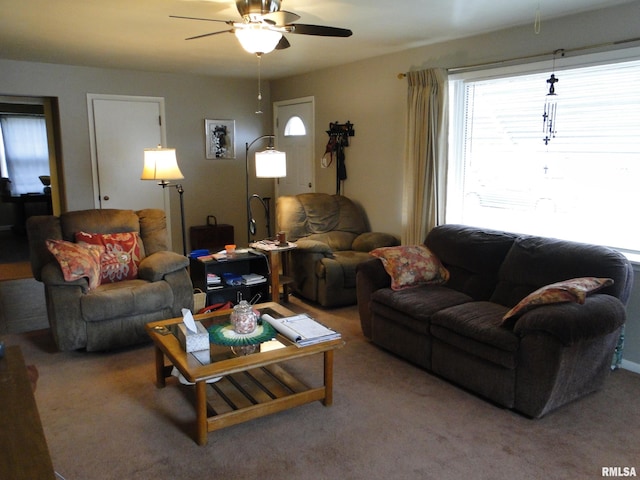 living room with ceiling fan and carpet floors