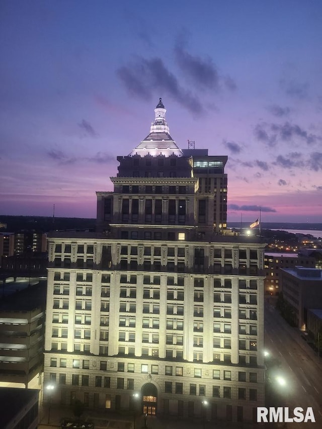 view of outdoor building at dusk