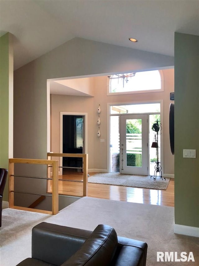 living room featuring lofted ceiling