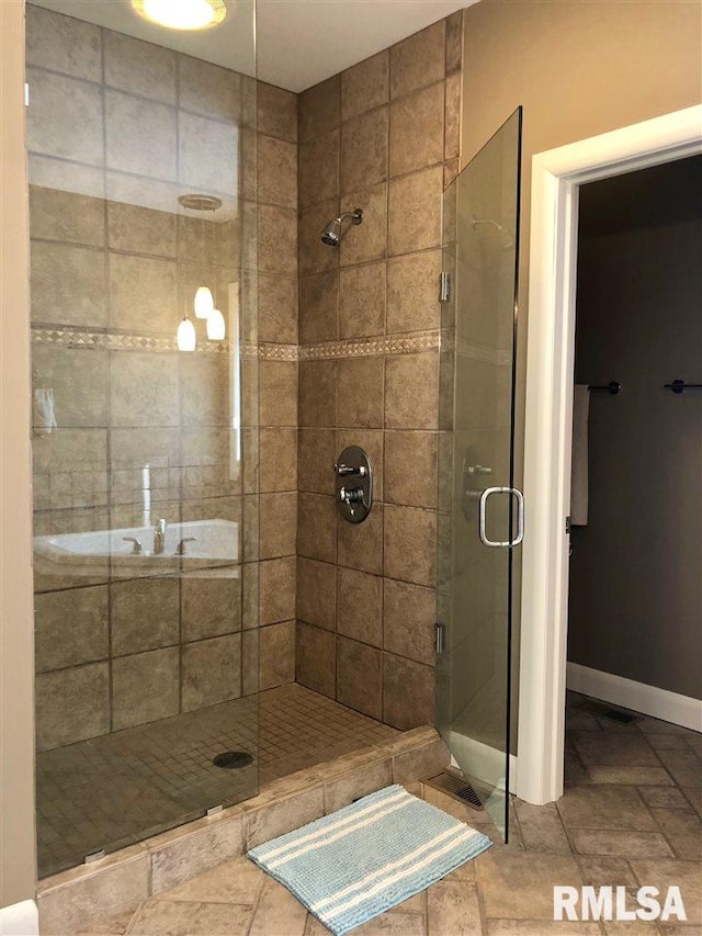 bathroom featuring an enclosed shower