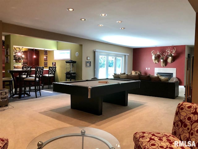 recreation room with light colored carpet and pool table