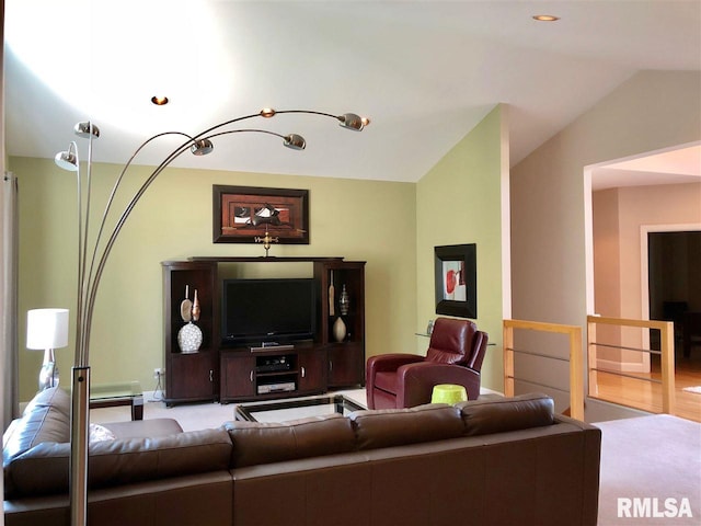 living room featuring vaulted ceiling