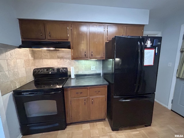 kitchen featuring black appliances and decorative backsplash