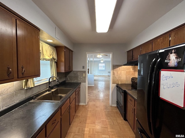 kitchen featuring sink, backsplash, ceiling fan, and black appliances