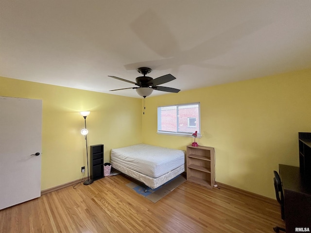 bedroom featuring ceiling fan and wood-type flooring