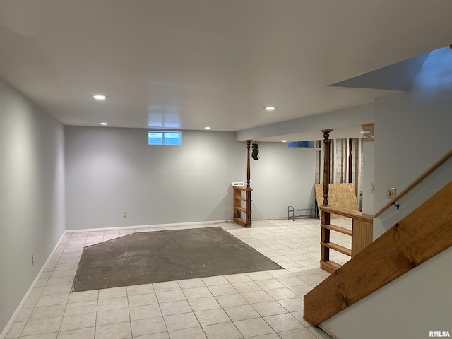 basement featuring light tile patterned floors