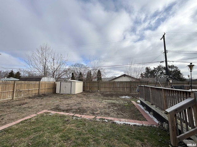 view of yard featuring a shed and a deck