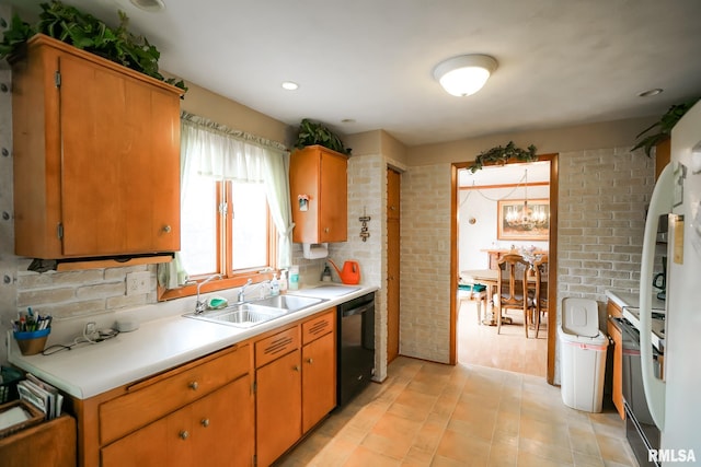 kitchen with light tile patterned flooring, sink, a notable chandelier, and black appliances