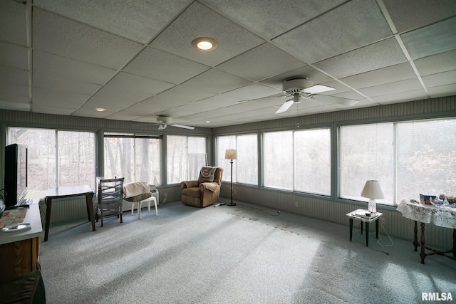 sunroom featuring ceiling fan and a drop ceiling