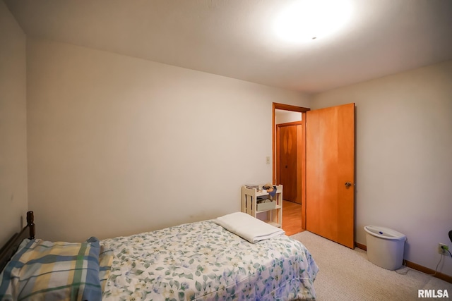 bedroom with light colored carpet