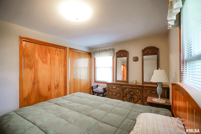 bedroom featuring multiple closets