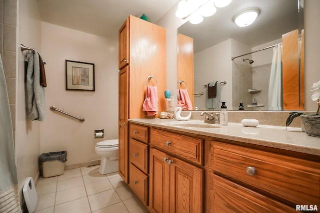 bathroom featuring tile patterned flooring, a shower with curtain, vanity, and toilet