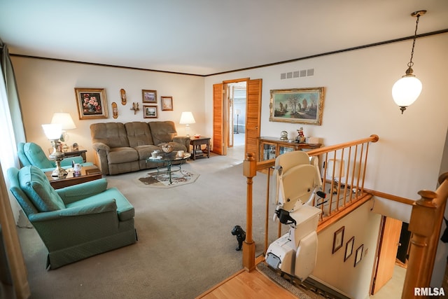 living room with hardwood / wood-style flooring and ornamental molding