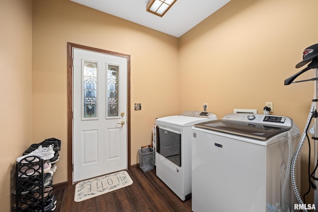 washroom featuring dark hardwood / wood-style flooring and washing machine and clothes dryer