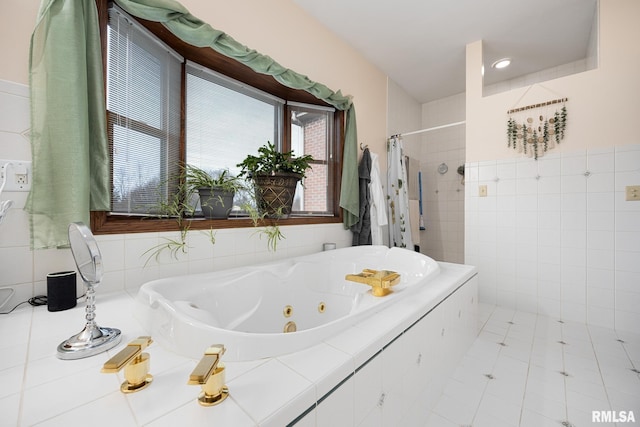 bathroom featuring tile patterned flooring and independent shower and bath