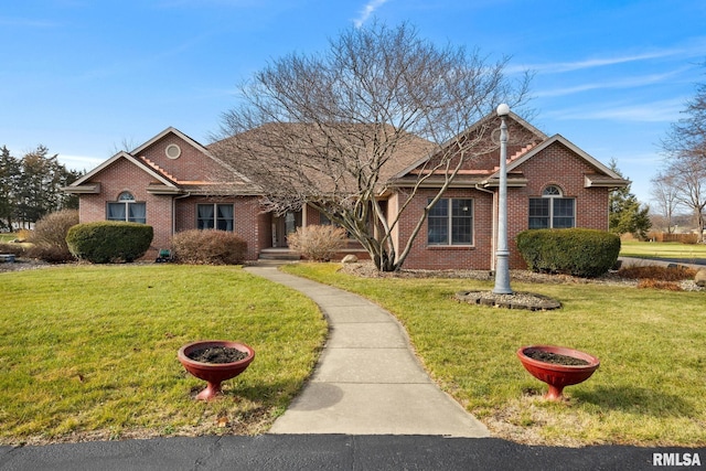 ranch-style home featuring a front yard