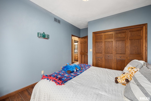 bedroom featuring a closet and hardwood / wood-style flooring