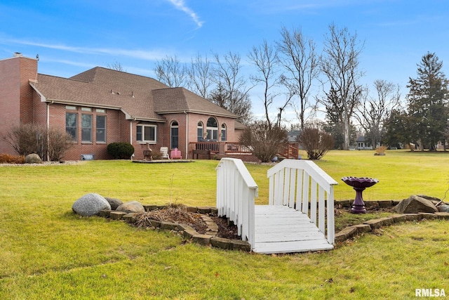 view of yard featuring a wooden deck