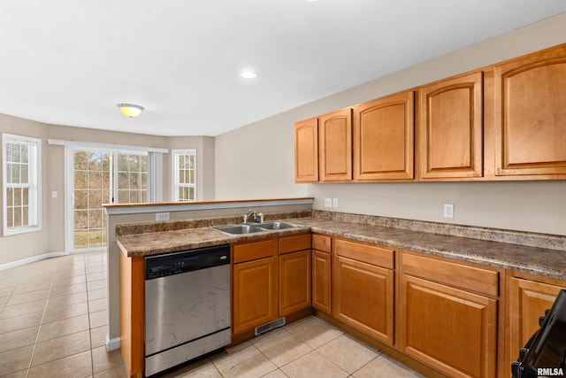 kitchen with stove, sink, stainless steel dishwasher, light tile patterned floors, and kitchen peninsula