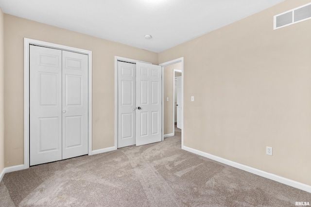 unfurnished bedroom with light carpet