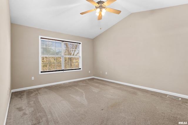 spare room with carpet floors, ceiling fan, and lofted ceiling