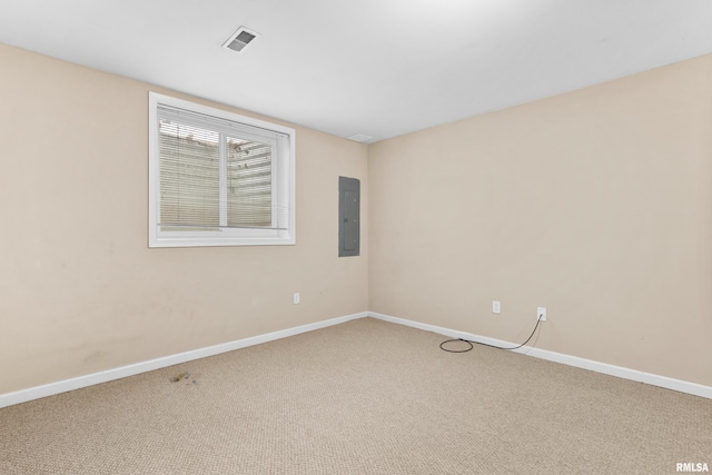 spare room featuring carpet flooring and electric panel